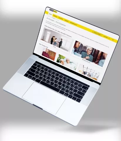 macbook-zeigt-content-redaktion-auf-immowelt-webseite-weiß-gelbes-design